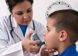Boy with asthma inhaler