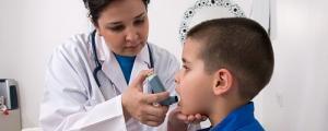Boy with asthma inhaler